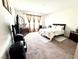 Cozy bedroom with soft carpet, curtains, and dresser at 6436 Linden St, North Las Vegas, NV 89086