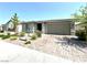 Attractive single-story home boasts desert landscaping and a paver driveway at 6436 Linden St, North Las Vegas, NV 89086