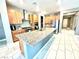 Stylish kitchen with granite countertops, modern appliances, and maple cabinets with stainless steel range hood at 6436 Linden St, North Las Vegas, NV 89086
