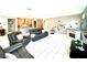 Spacious living room featuring an open floorplan, tile flooring, and comfortable leather sofas at 6436 Linden St, North Las Vegas, NV 89086