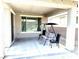 Covered patio featuring brick pavers, a swing, and a chair at 6436 Linden St, North Las Vegas, NV 89086