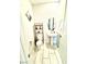 Bright powder room with a pedestal sink, decorative mirror, and tile flooring at 6436 Linden St, North Las Vegas, NV 89086