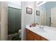 Well-lit bathroom with a spacious vanity, sink, and framed mirror at 672 Hitchen Post Dr, Henderson, NV 89011