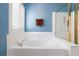 Bathroom featuring a luxurious soaking tub, shower, and natural light at 672 Hitchen Post Dr, Henderson, NV 89011