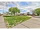 Neighborhood green space and walking path with mature trees and landscaping at 672 Hitchen Post Dr, Henderson, NV 89011