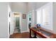 Hallway with beautiful wood floors and well-lit access to the bathroom and bedroom at 672 Hitchen Post Dr, Henderson, NV 89011