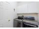 This laundry room features front-loading washer and dryer units at 672 Hitchen Post Dr, Henderson, NV 89011