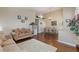 Spacious living area with hardwood floors, decorative accents, and plenty of natural light at 672 Hitchen Post Dr, Henderson, NV 89011