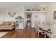 Open living space with hardwood floors, a decorative chandelier, and neutral decor at 672 Hitchen Post Dr, Henderson, NV 89011