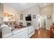 Spacious living room with hardwood floors, fireplace, and comfortable seating area at 672 Hitchen Post Dr, Henderson, NV 89011