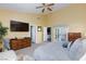 Large bedroom featuring double doors to another room and a neutral color palette at 672 Hitchen Post Dr, Henderson, NV 89011