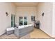 Covered patio with comfortable seating and a barbecue grill at 672 Hitchen Post Dr, Henderson, NV 89011