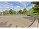 Community sand volleyball court with net, lights and mature landscaping at 672 Hitchen Post Dr, Henderson, NV 89011