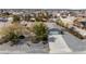 Aerial view of a single story home with a two car garage, surrounded by desert landscaping at 6860 Stubblefield Dr, Pahrump, NV 89061