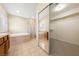 Relaxing bathroom with tiled tub, a glass enclosed shower, and mirrored closet at 6860 Stubblefield Dr, Pahrump, NV 89061