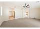 Spacious bedroom with a ceiling fan and adjoining bathroom and closet at 6860 Stubblefield Dr, Pahrump, NV 89061