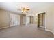 Spacious bedroom with mirrored closet doors and plantation shutters offers ample natural light at 6860 Stubblefield Dr, Pahrump, NV 89061