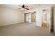 Carpeted bedroom featuring mirrored closet doors and natural light at 6860 Stubblefield Dr, Pahrump, NV 89061