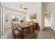 Bright dining room with plantation shutters and stylish decor; perfect for Gathering meals at 6860 Stubblefield Dr, Pahrump, NV 89061