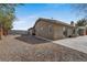 Exterior view showcasing the home's architecture, desert landscaping, and spacious backyard at 6860 Stubblefield Dr, Pahrump, NV 89061