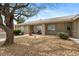 Inviting front exterior with desert landscaping, and a cozy porch with seating at 6860 Stubblefield Dr, Pahrump, NV 89061