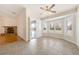 Relaxing living area with fireplace and large windows bringing in natural light at 6860 Stubblefield Dr, Pahrump, NV 89061