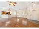 Bright living room with hardwood floors, vaulted ceilings, and large windows with custom shutters at 6860 Stubblefield Dr, Pahrump, NV 89061