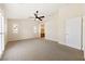 Spacious main bedroom with plush carpeting, neutral walls, and ample natural light at 6860 Stubblefield Dr, Pahrump, NV 89061