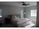 Spacious bedroom boasts a ceiling fan and multiple windows that provide plenty of natural light at 7022 Judith River St, North Las Vegas, NV 89084