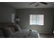 Spacious bedroom boasts a ceiling fan and multiple windows that provide plenty of natural light at 7022 Judith River St, North Las Vegas, NV 89084