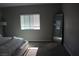 Spacious bedroom boasts a ceiling fan, large mirror, and multiple windows that provide plenty of natural light at 7022 Judith River St, North Las Vegas, NV 89084