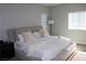 Spacious bedroom boasts a ceiling fan and multiple windows that provide plenty of natural light at 7022 Judith River St, North Las Vegas, NV 89084