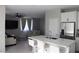 An open floor plan showcasing the living room, with a kitchen island and modern furniture at 7022 Judith River St, North Las Vegas, NV 89084