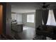 Open concept living area with tile floors, modern furnishings, and lots of natural light at 7022 Judith River St, North Las Vegas, NV 89084