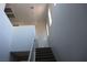 Bright view looking up a modern staircase featuring lots of light at 7022 Judith River St, North Las Vegas, NV 89084