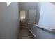 Bright staircase leading to the entrance, complemented by neutral tones and a handrail at 7022 Judith River St, North Las Vegas, NV 89084
