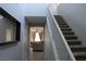 Bright entryway featuring a staircase and a view into the living room at 7022 Judith River St, North Las Vegas, NV 89084