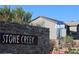 Stone Creek community signage highlights the neighborhood's name and location within the city at 7022 Judith River St, North Las Vegas, NV 89084