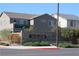 Stone Creek entrance with stone wall and manicured landscaping welcomes residents and visitors at 7022 Judith River St, North Las Vegas, NV 89084