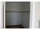 Empty walk-in closet featuring carpeted floors, a hanging rod, and shelves for organization at 7022 Judith River St, North Las Vegas, NV 89084