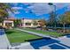Well-maintained bocce ball court with lush green turf, set against a backdrop of mature trees at 7741 Fruit Dove St, North Las Vegas, NV 89084