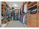 Spacious walk-in closet with custom shelving and ample storage, designed for organization and convenience at 7741 Fruit Dove St, North Las Vegas, NV 89084