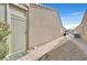 Home exterior with a pathway leading to the entrance; decorative rock and landscaping at 7741 Fruit Dove St, North Las Vegas, NV 89084