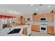 Bright kitchen featuring stone countertops, stainless steel appliances and backsplash at 7741 Fruit Dove St, North Las Vegas, NV 89084
