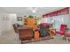 Cozy living room with comfortable seating, tile flooring, and natural light at 7741 Fruit Dove St, North Las Vegas, NV 89084