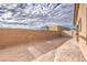 Enclosed backyard with brick wall and fence, offering a private and secure outdoor space at 7910 Pandora Sky St # 271, North Las Vegas, NV 89084