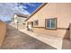 Spacious backyard offers privacy with a combination of fencing, providing room for outdoor activities at 7910 Pandora Sky St # 271, North Las Vegas, NV 89084