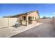 Spacious backyard area with gravel and partial fencing offers privacy and potential for customization at 7910 Pandora Sky St # 271, North Las Vegas, NV 89084