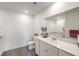 Bright bathroom featuring a white vanity, sink, and decorative plants, offering a clean and modern aesthetic at 7910 Pandora Sky St # 271, North Las Vegas, NV 89084