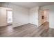 Spacious bedroom featuring wood flooring, a walk-out balcony, and access to a bathroom at 7910 Pandora Sky St # 271, North Las Vegas, NV 89084